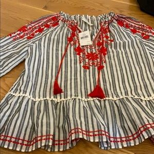 A blouse with red detailing